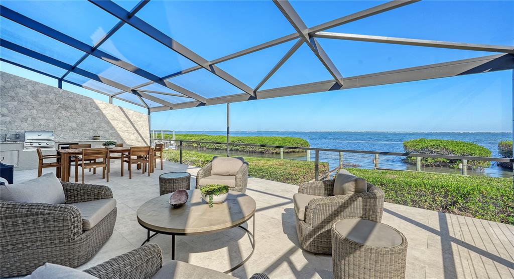 a outdoor dining space with furniture and outdoor view