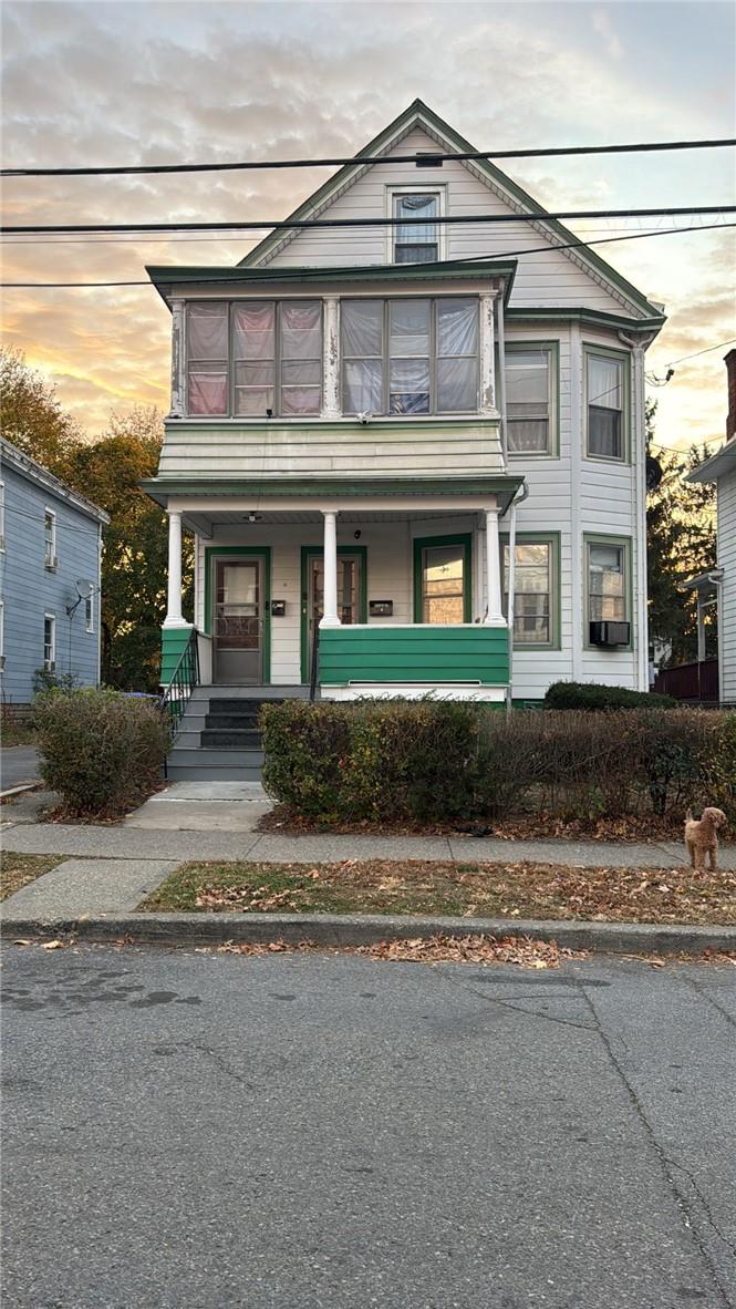 View of front of home featuring covered porch