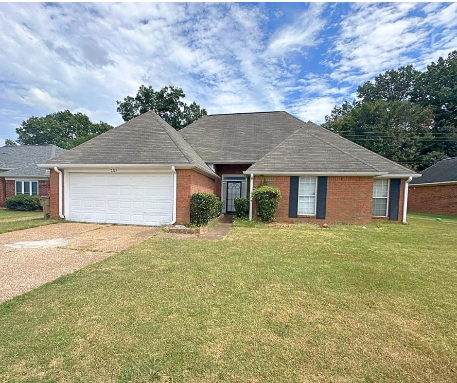 front view of a house with a yard