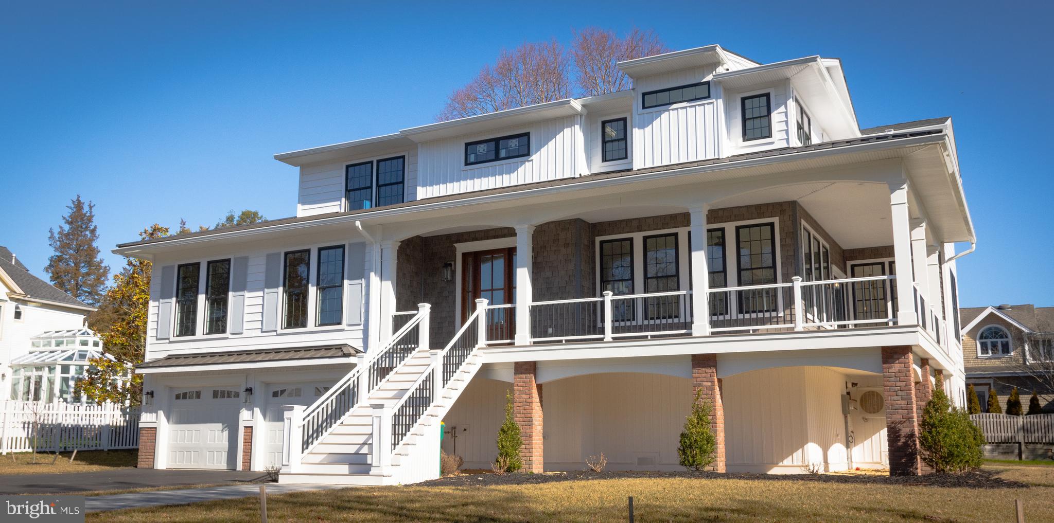 a front view of a house with many windows