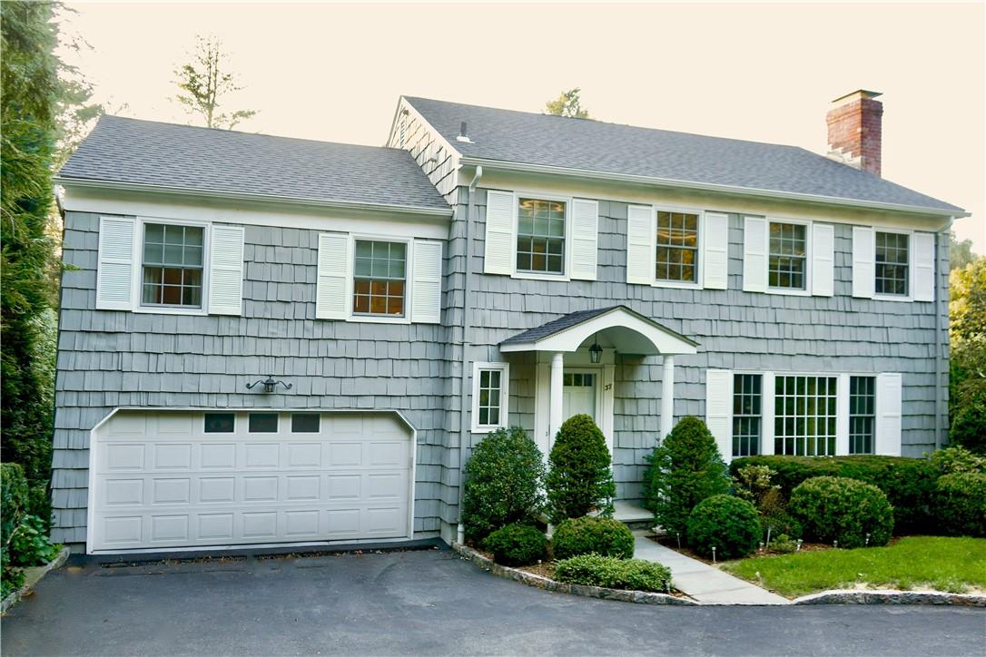 View of front of property with a garage