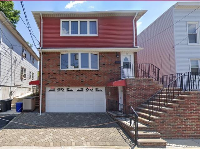 a front view of a house with yard