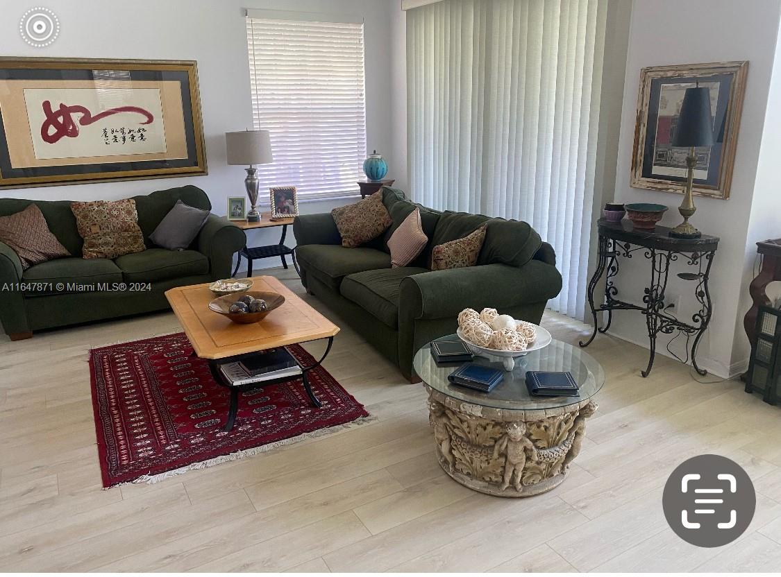 a living room with furniture and a rug