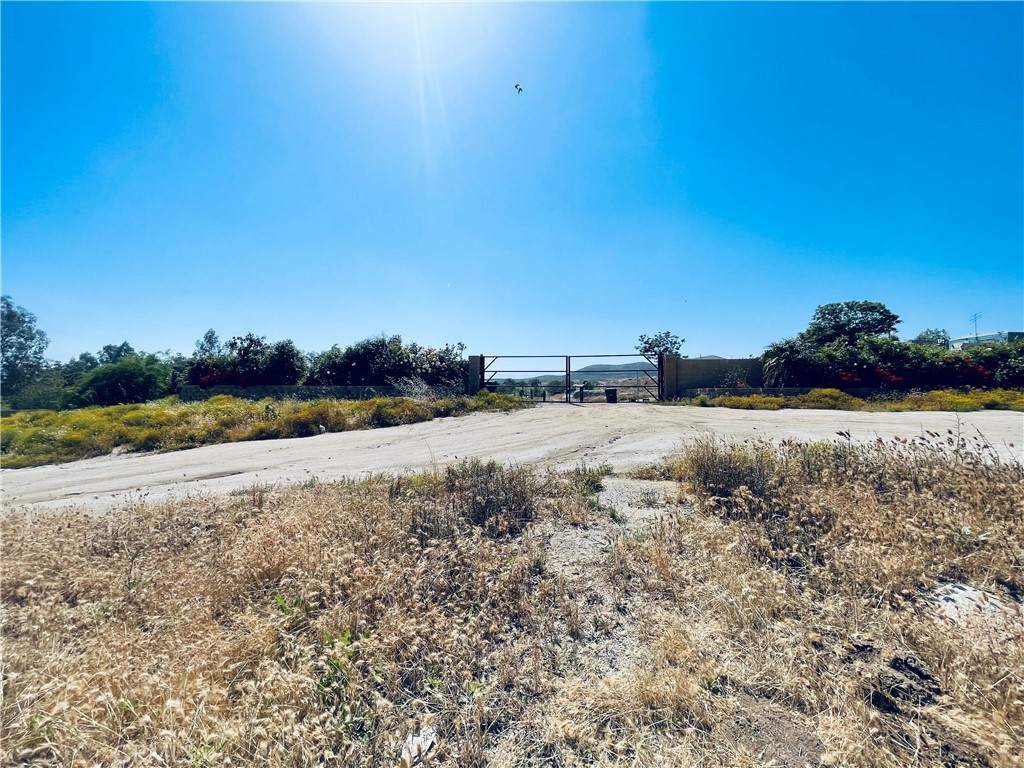 a view of a field with ocean view