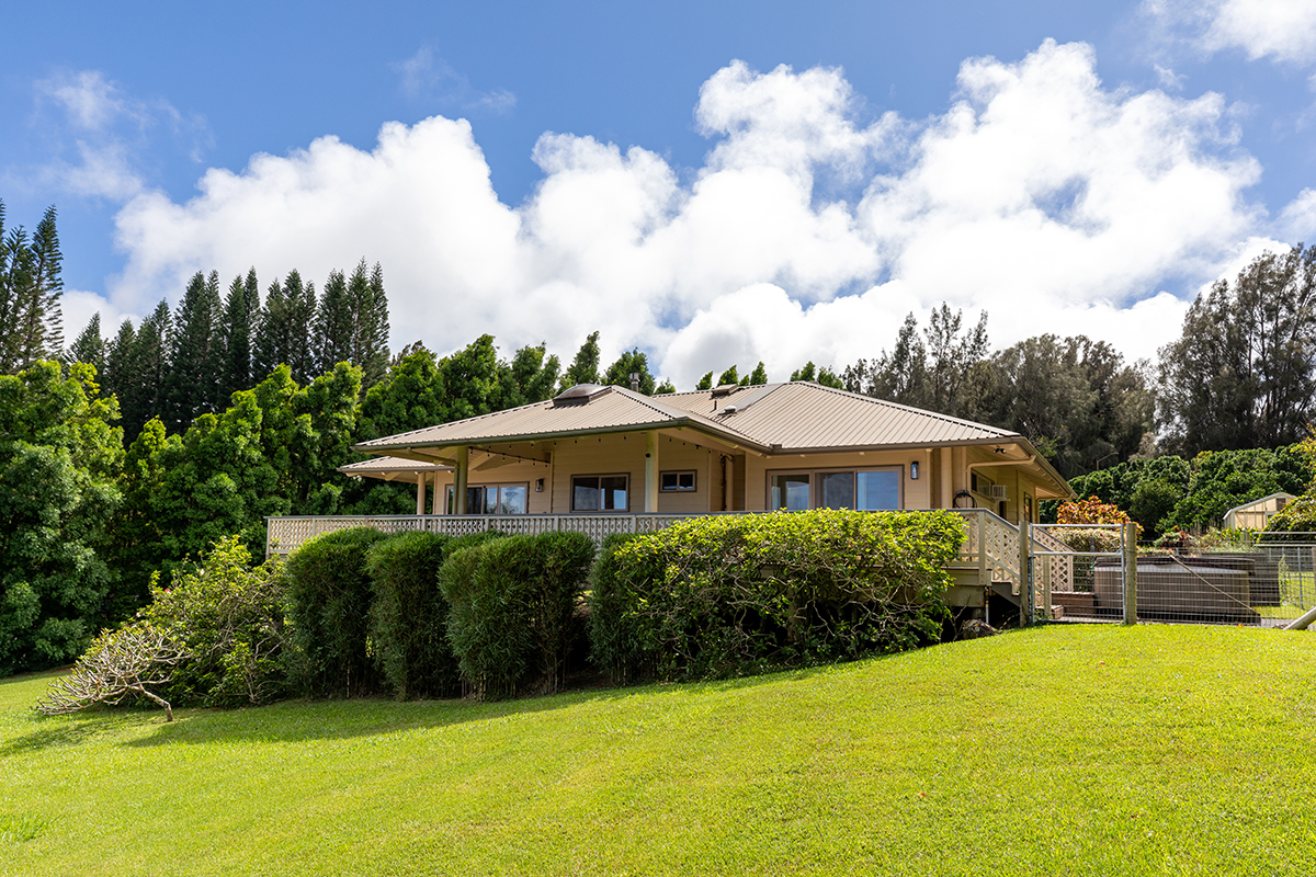 a view of a house with swimming pool and sitting area