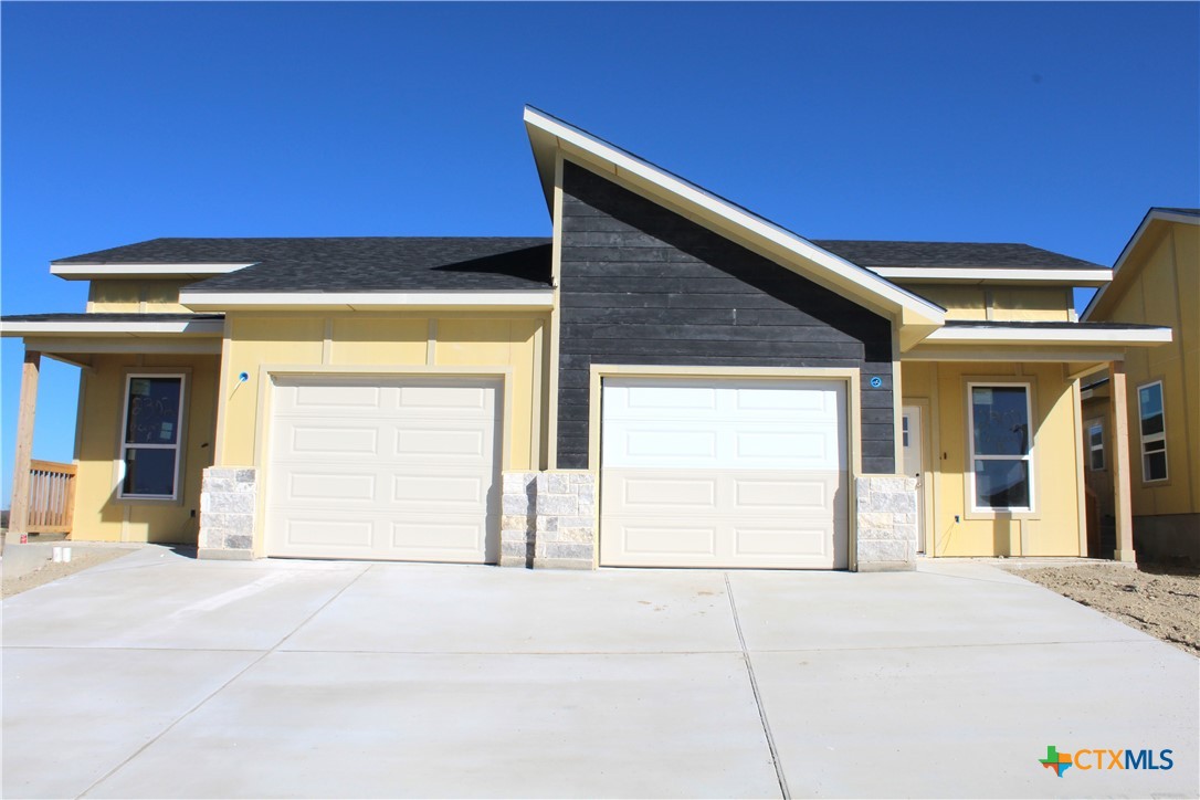 a front view of a house with a outdoor space