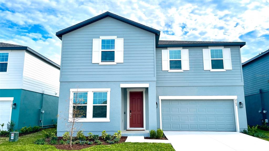 a front view of a house with garage