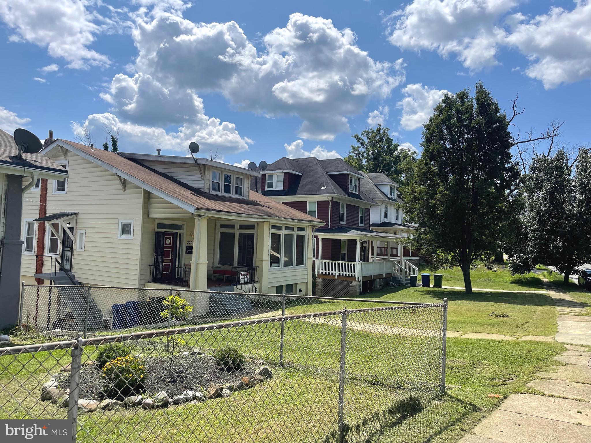 a front view of a house with a yard table and chairs