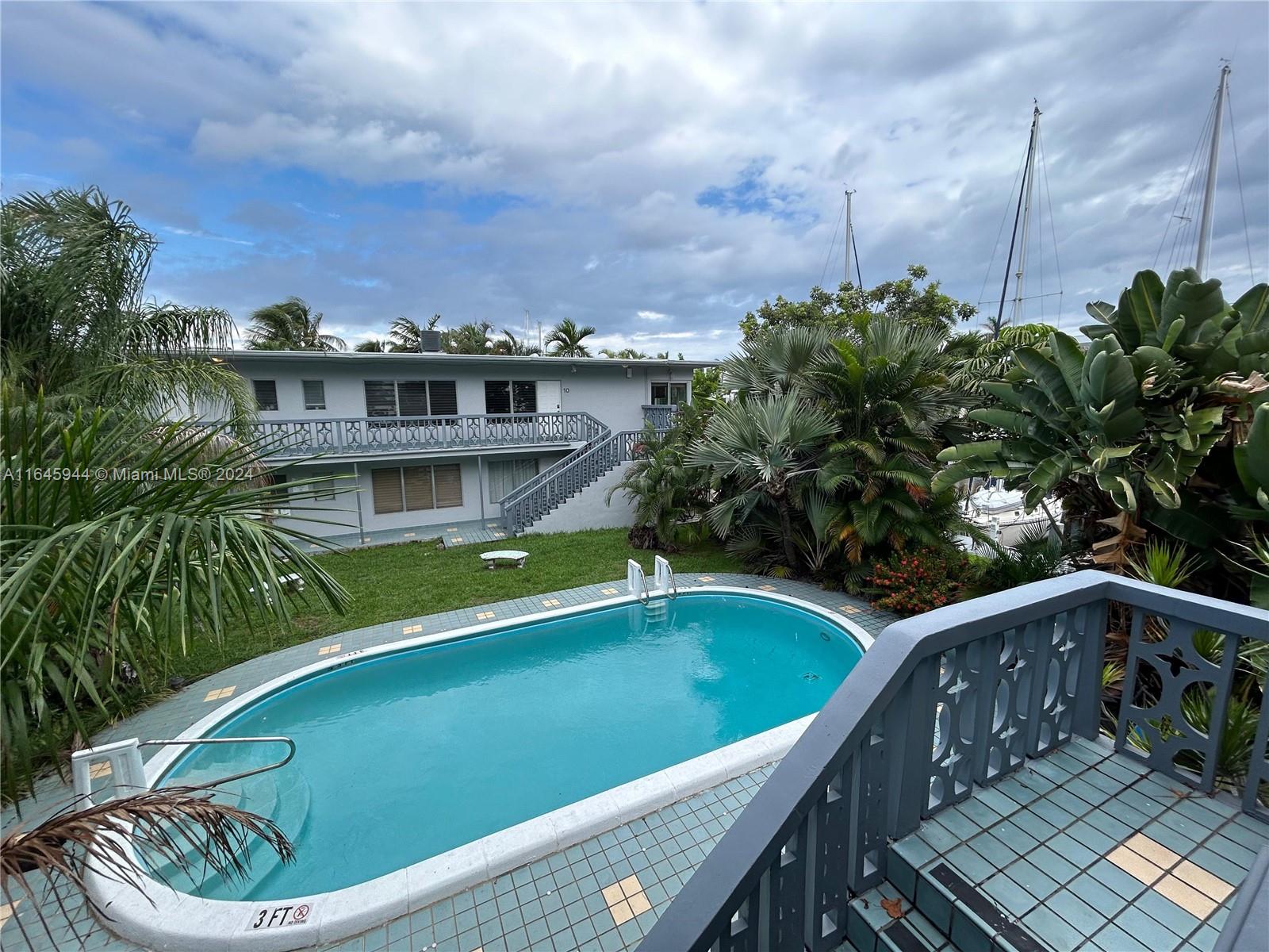 a view of a swimming pool with a patio