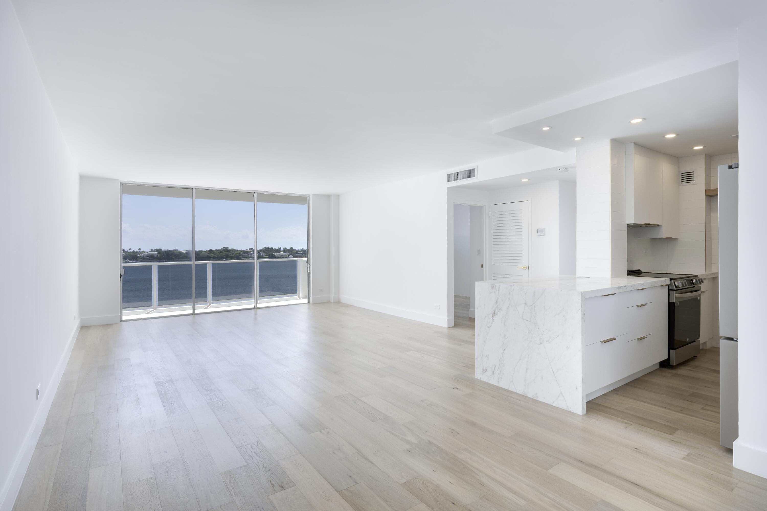 a view of kitchen with furniture and wooden floor