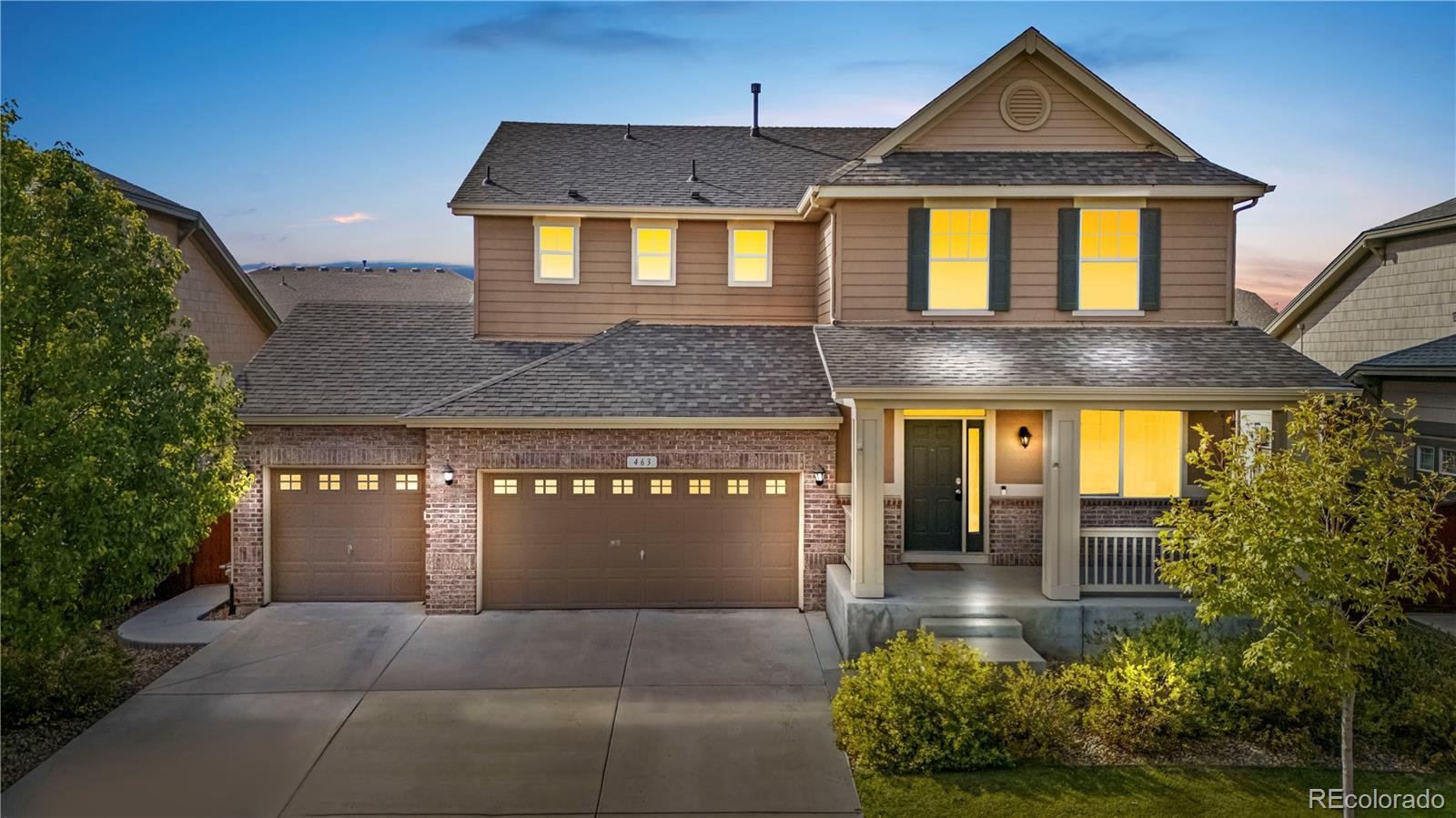 front view of a house with a yard