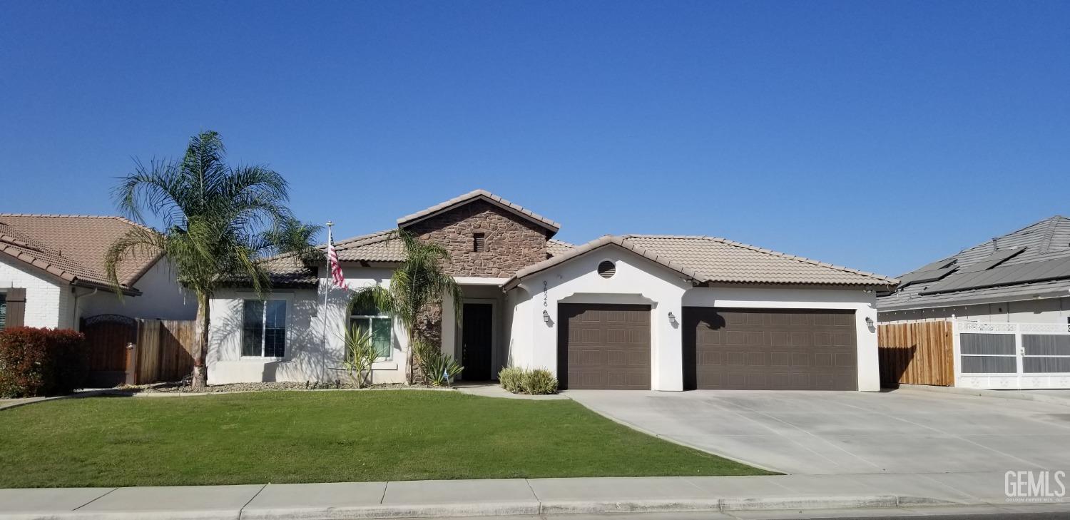 a front view of a house with a yard