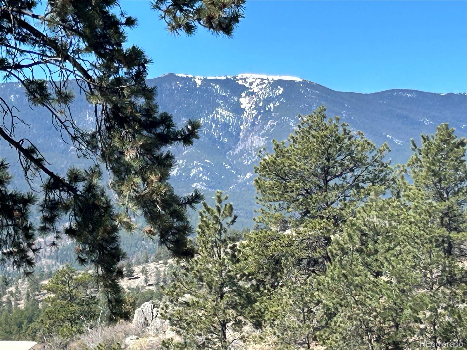 a view of a house with a mountain in the background