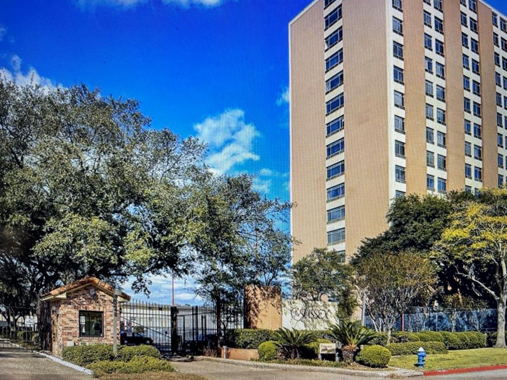 a front view of a building with trees