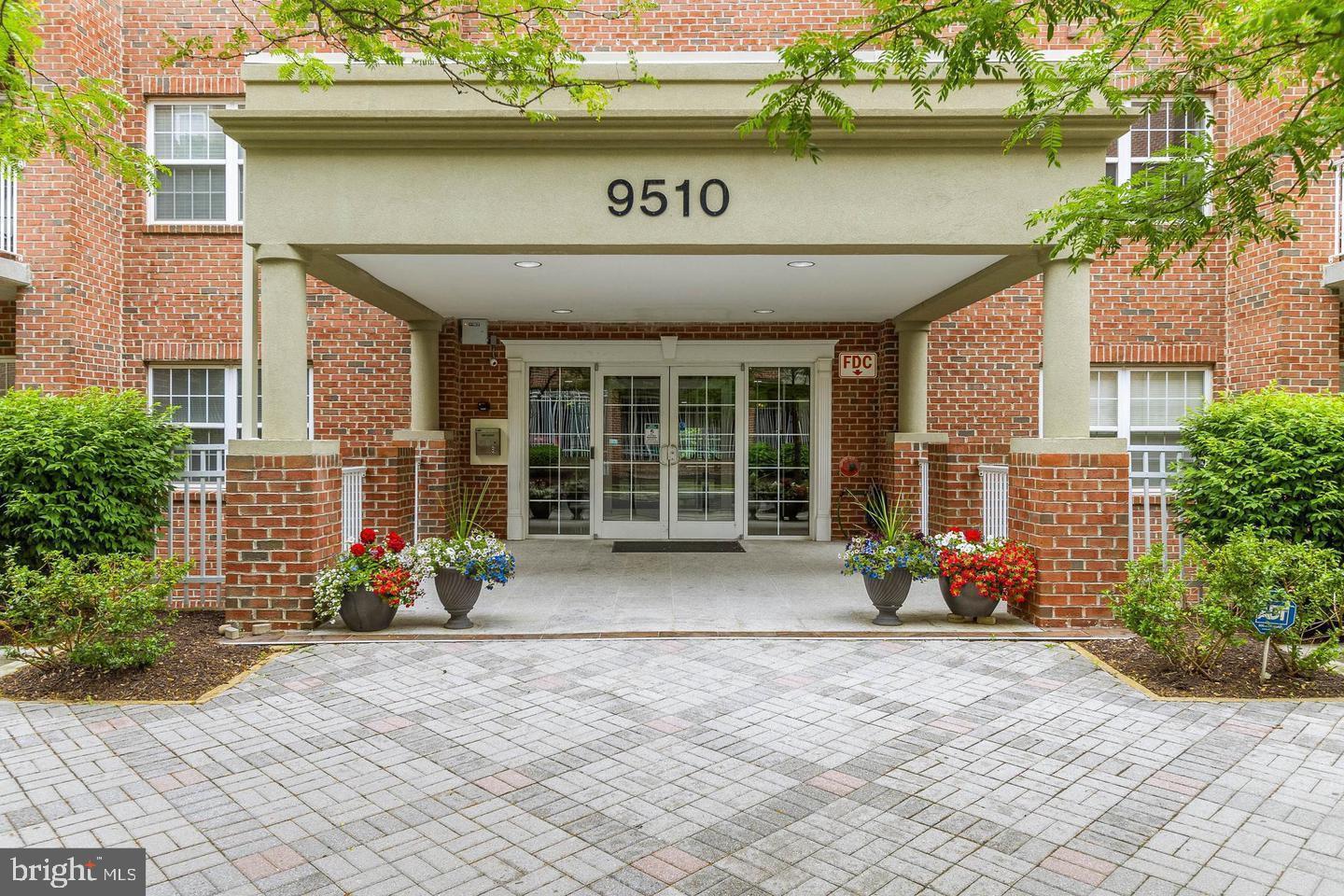 a front view of a building with garden