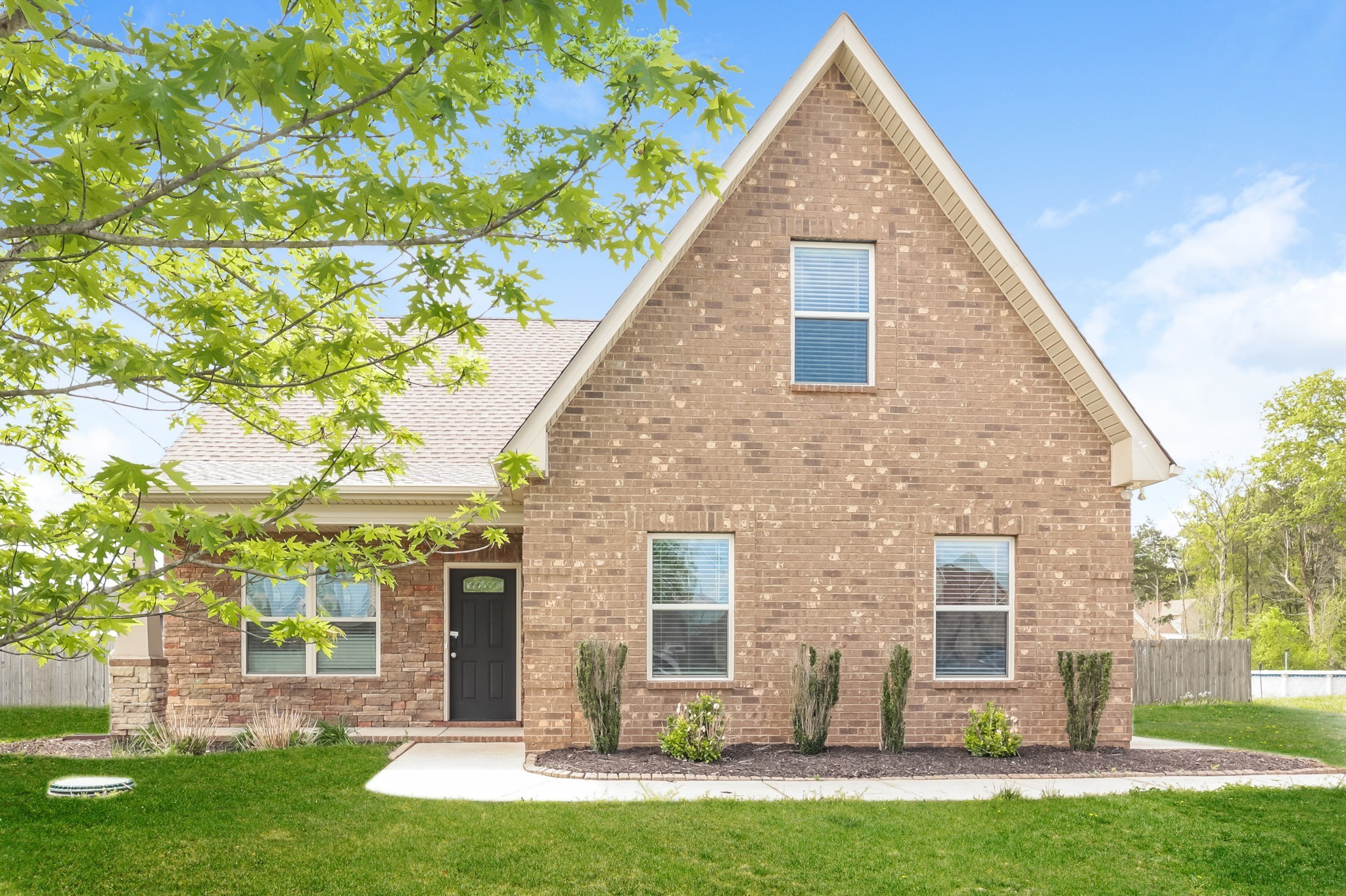 front view of a house with a yard