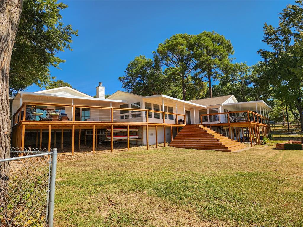 a view of house with outdoor space and swimming pool