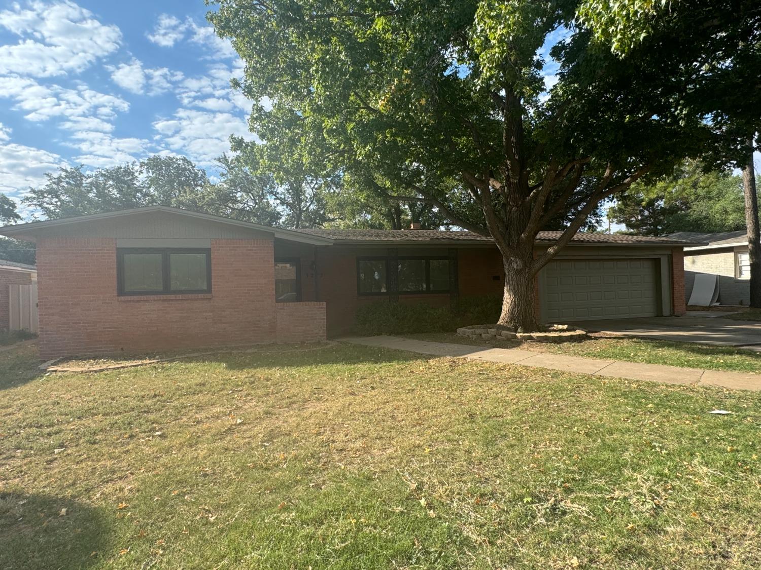 a house with yard in front of it