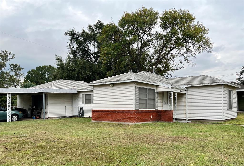 a house with trees in the background