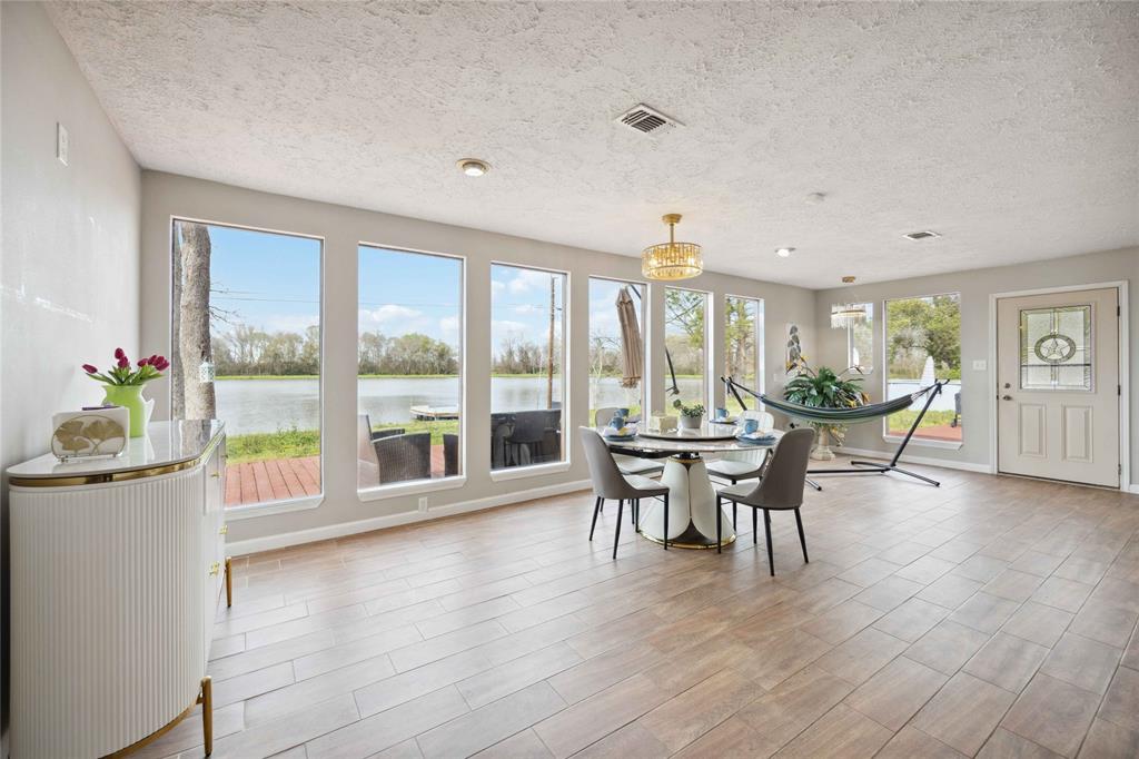 a dining room with furniture and wooden floor