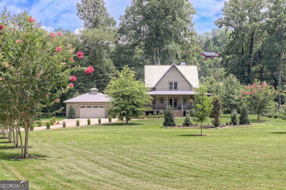 a front view of a house with garden