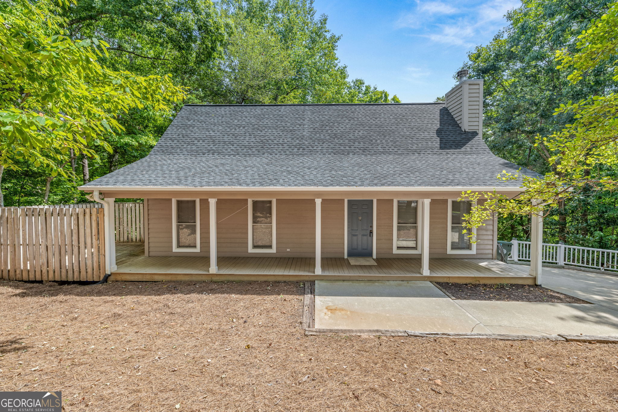 front view of a house with a garden