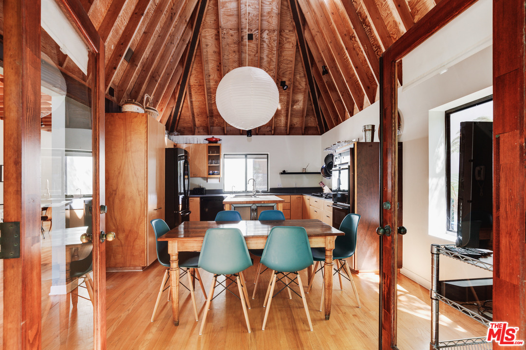 a view of dining room and hall with furniture