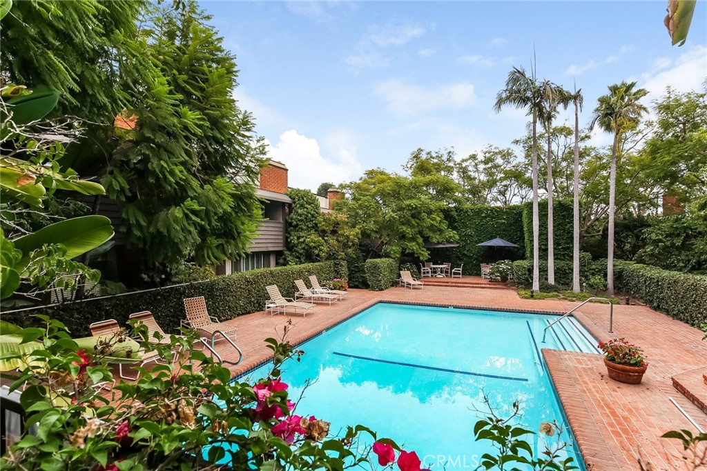 a view of a swimming pool with a patio