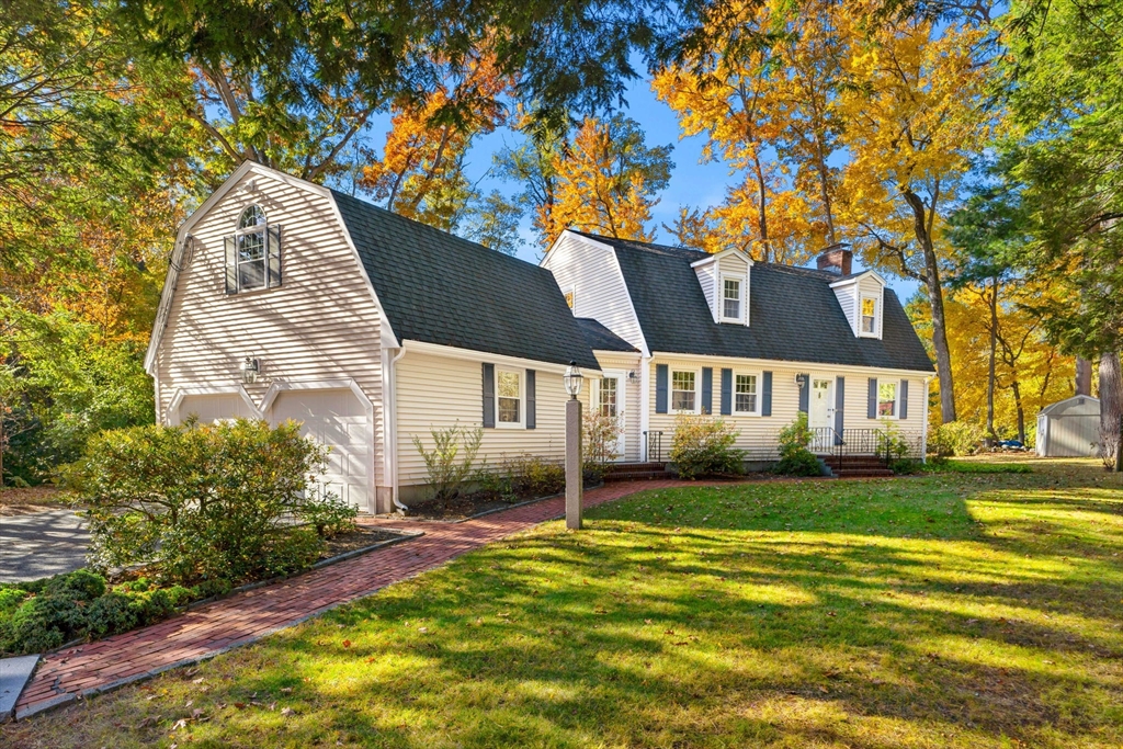 a view of a house with a backyard