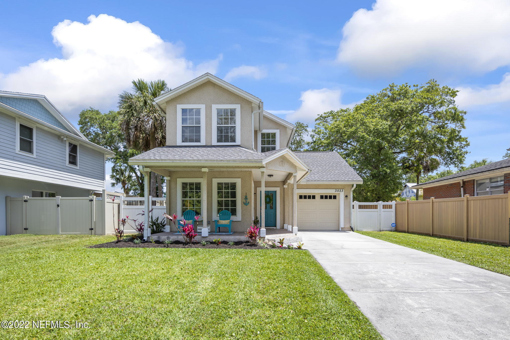 a front view of a house with garden