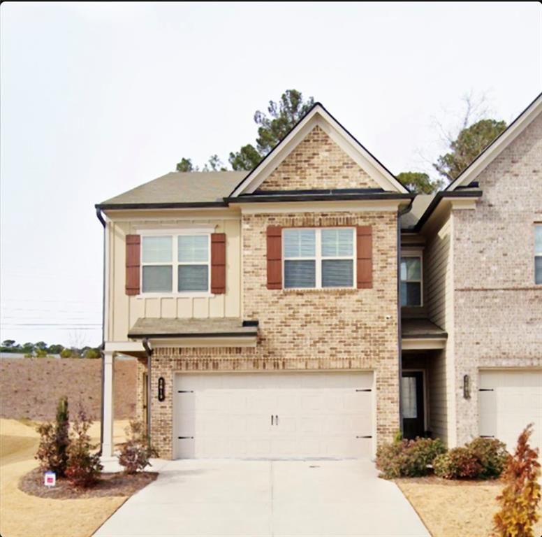 a front view of a house with yard