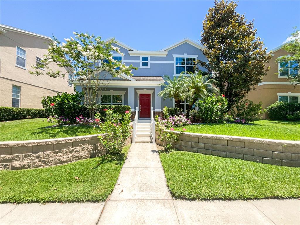 a front view of house with yard and green space