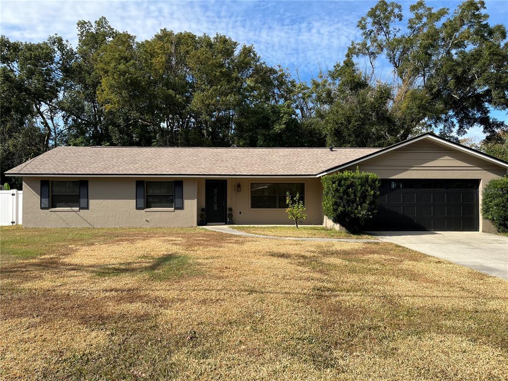 a house with yard in front of it