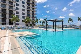 a swimming pool with outdoor seating and yard