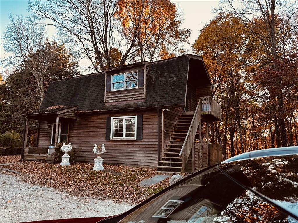 a backyard of a house with large trees