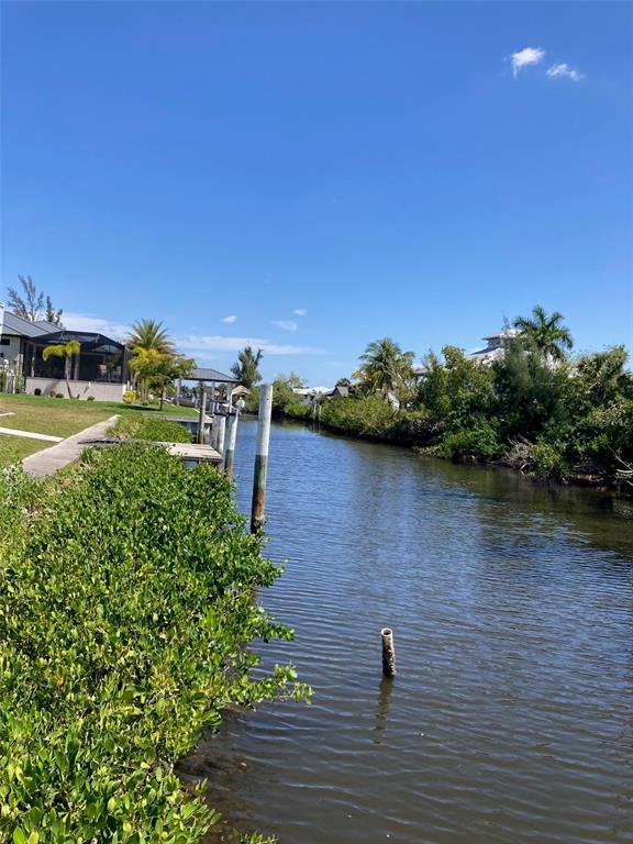 a view of a lake with a yard