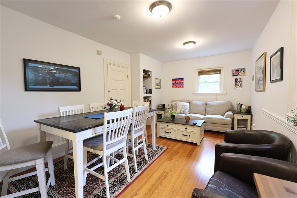 a view of a livingroom with furniture and wooden floor