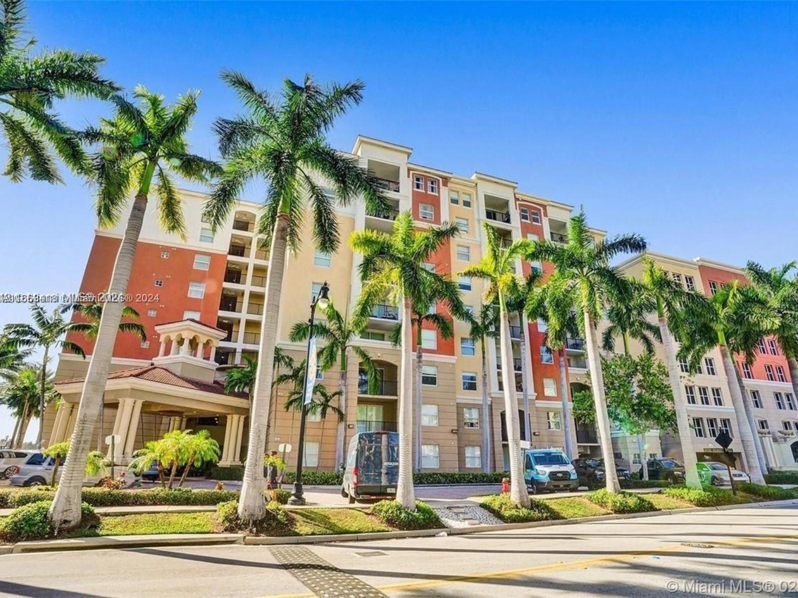 a view of a building with a palm tree