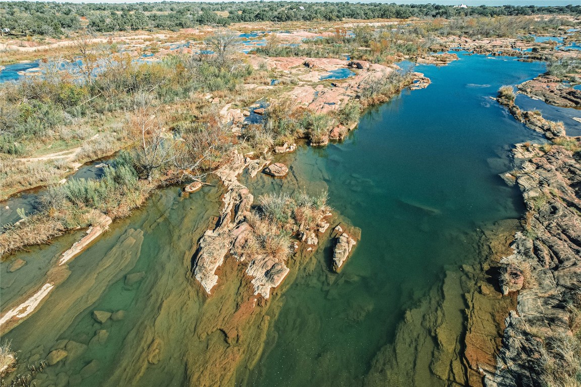 a view of lake with green space