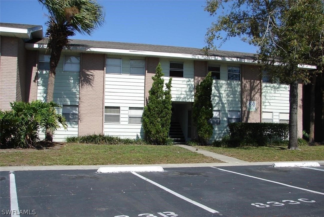 a view of a house with a yard