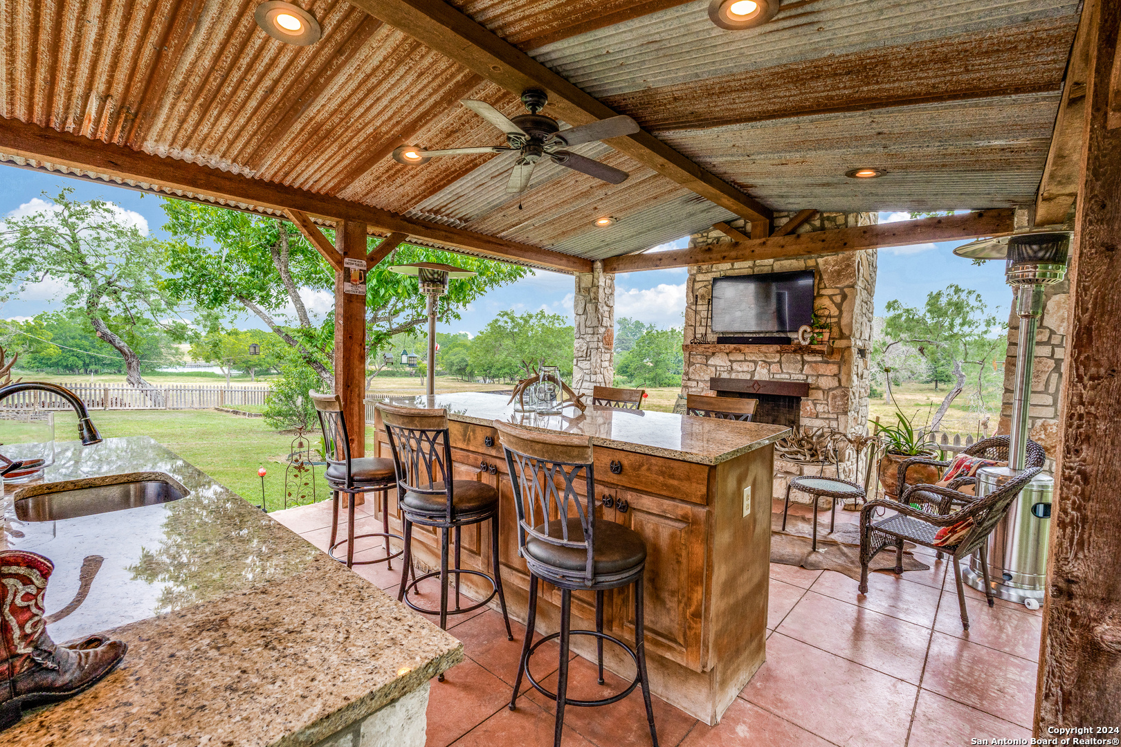 a dining space with furniture and garden view