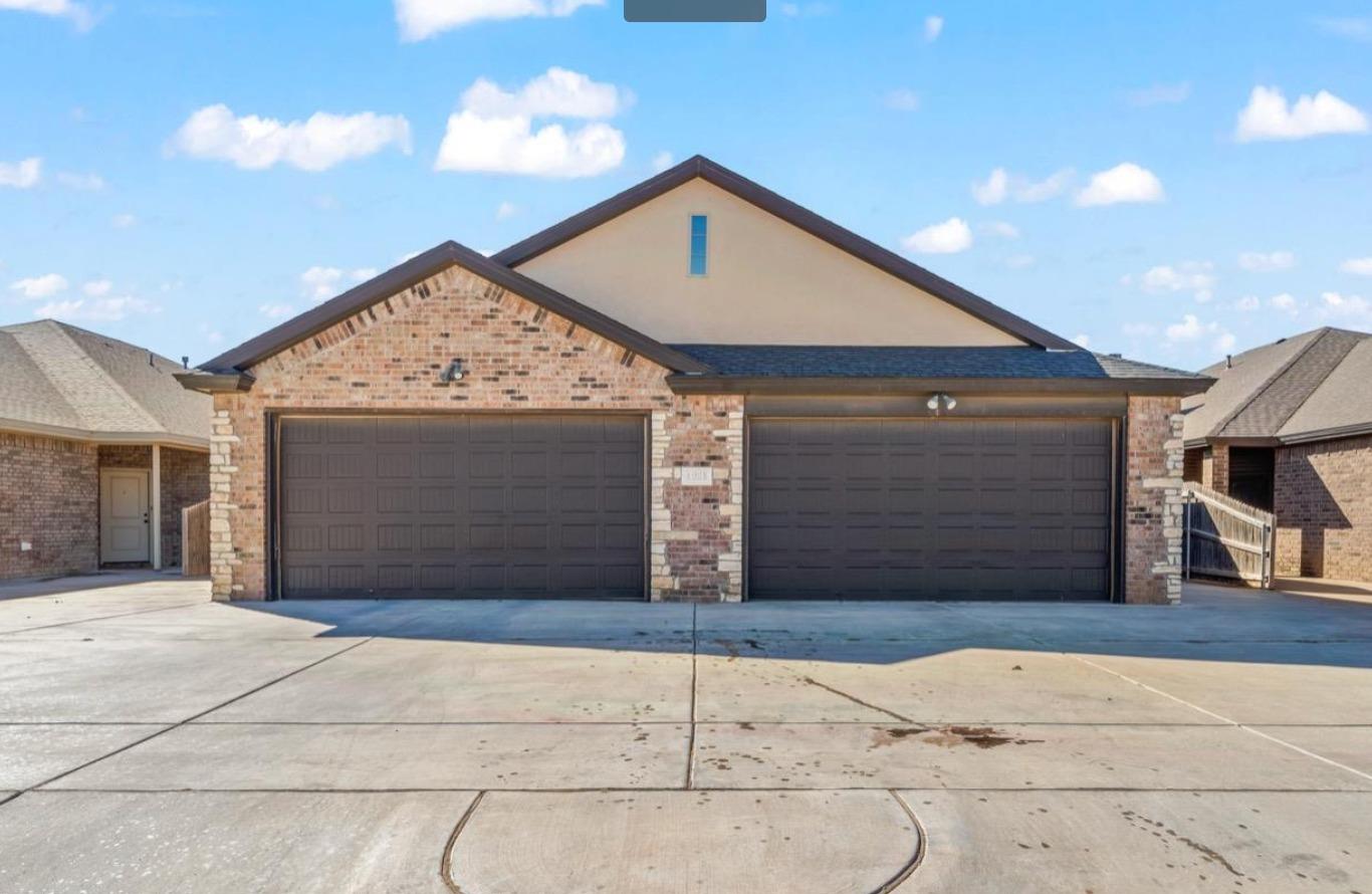 a front view of a house with a garage