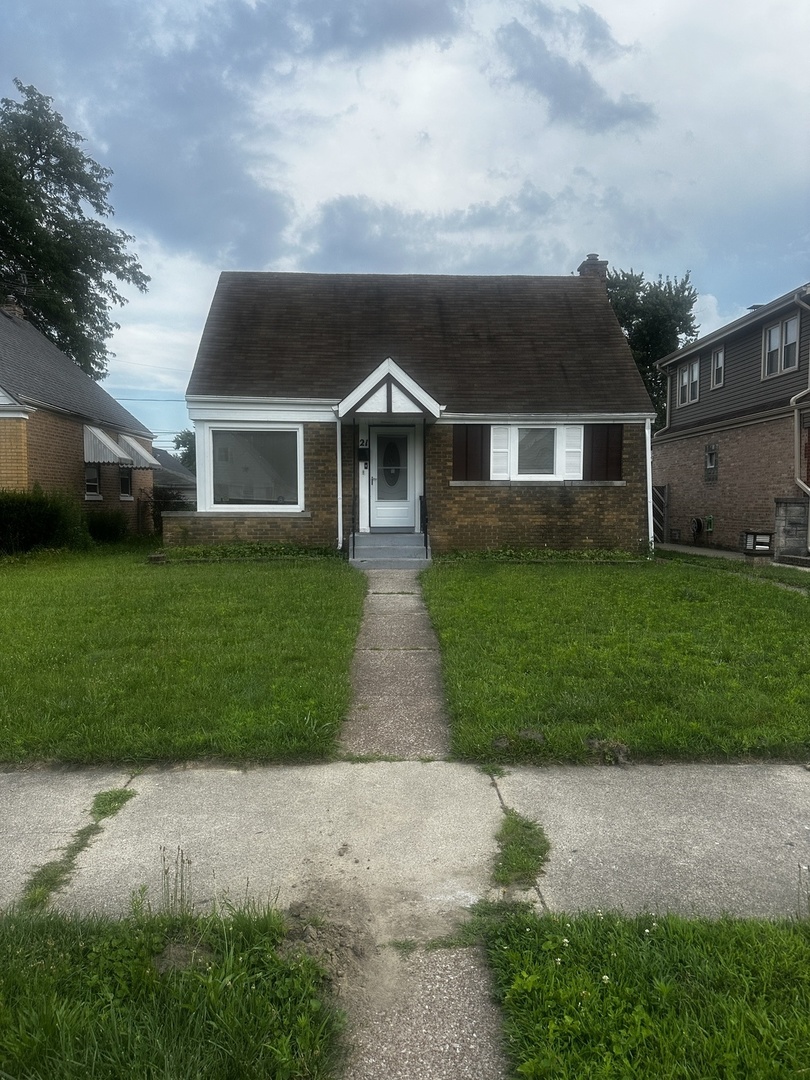 front view of a house with a yard