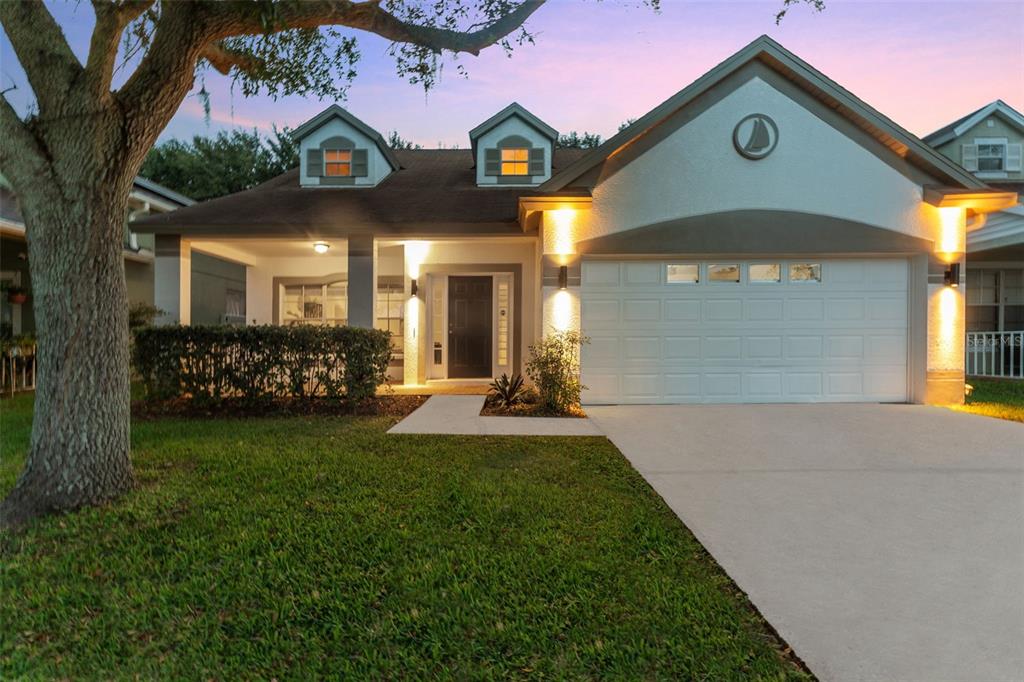 a front view of a house with a yard