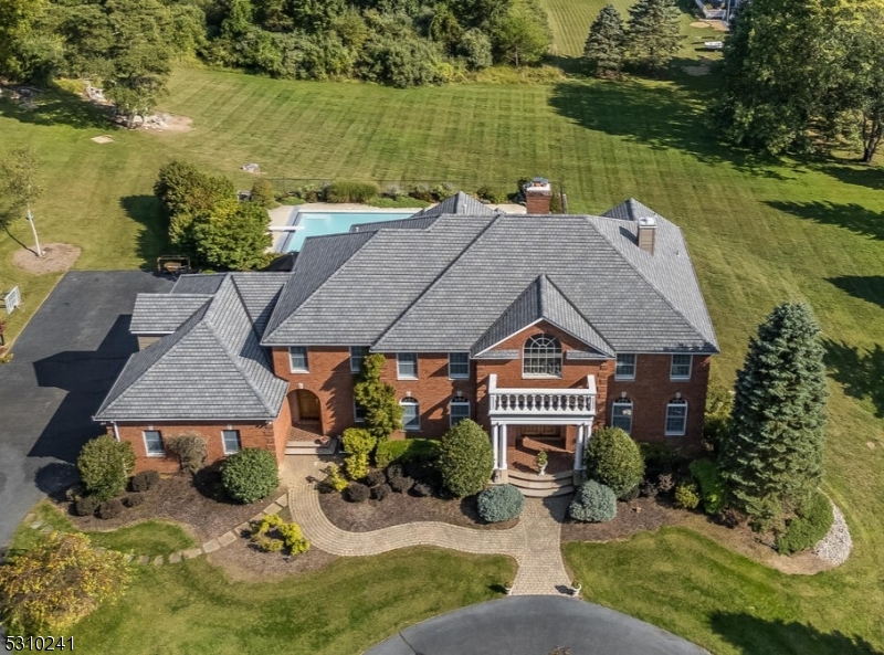 an aerial view of a house with a ocean view