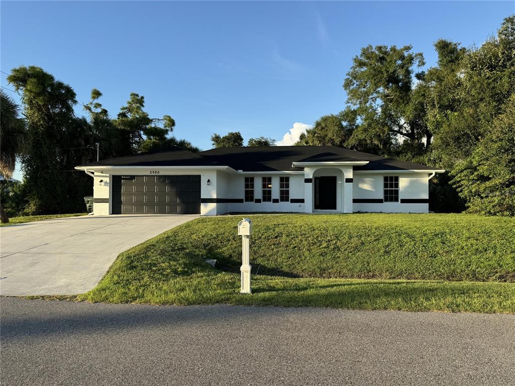 front view of a house with a garden