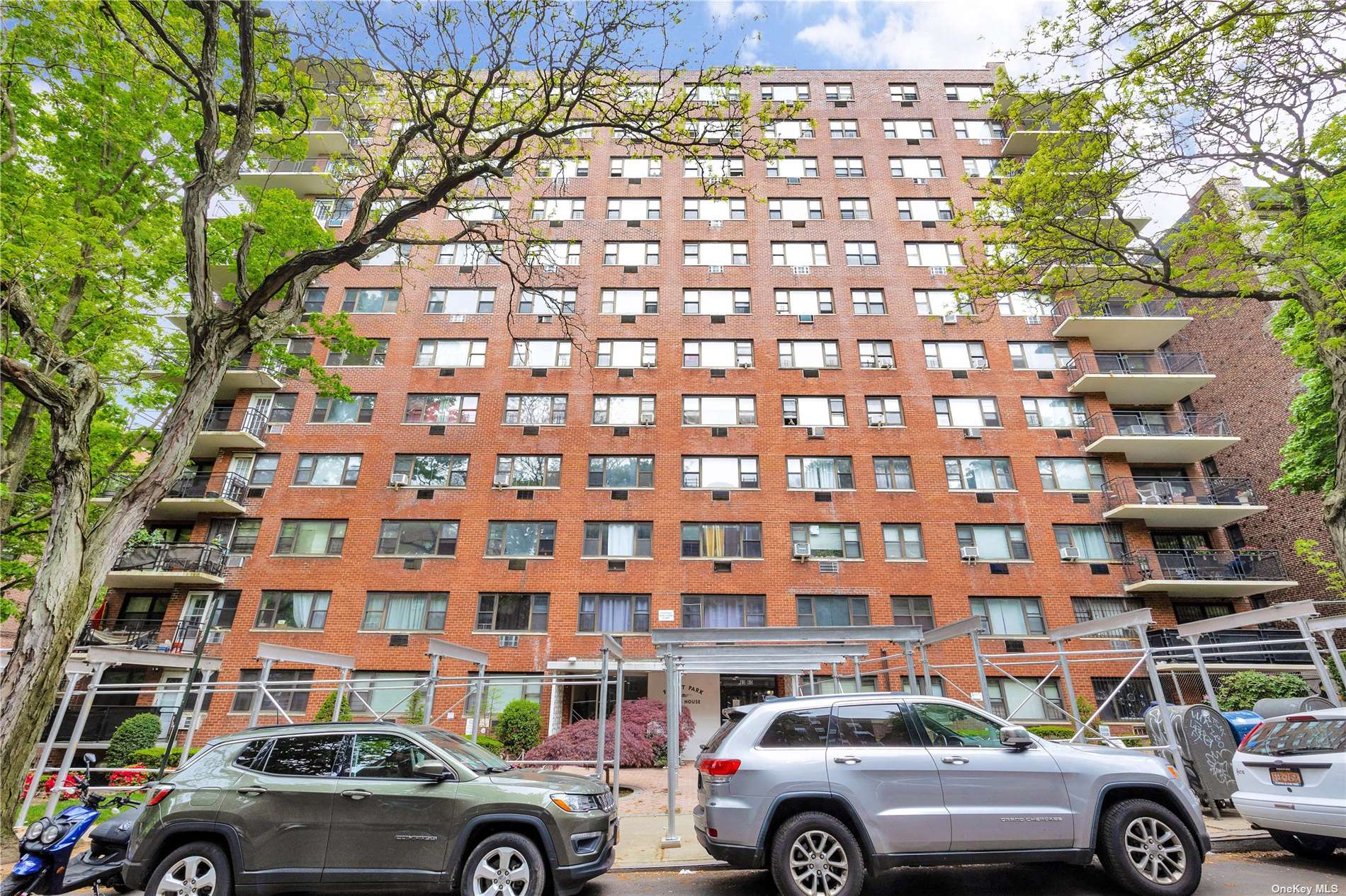 a front view of a building with parking space