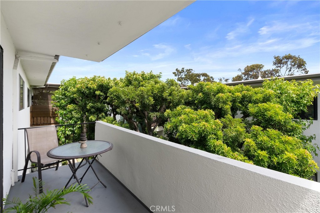 TOP FLOOR- Gorgeous balcony tree top views looks over interior lush courtyard.