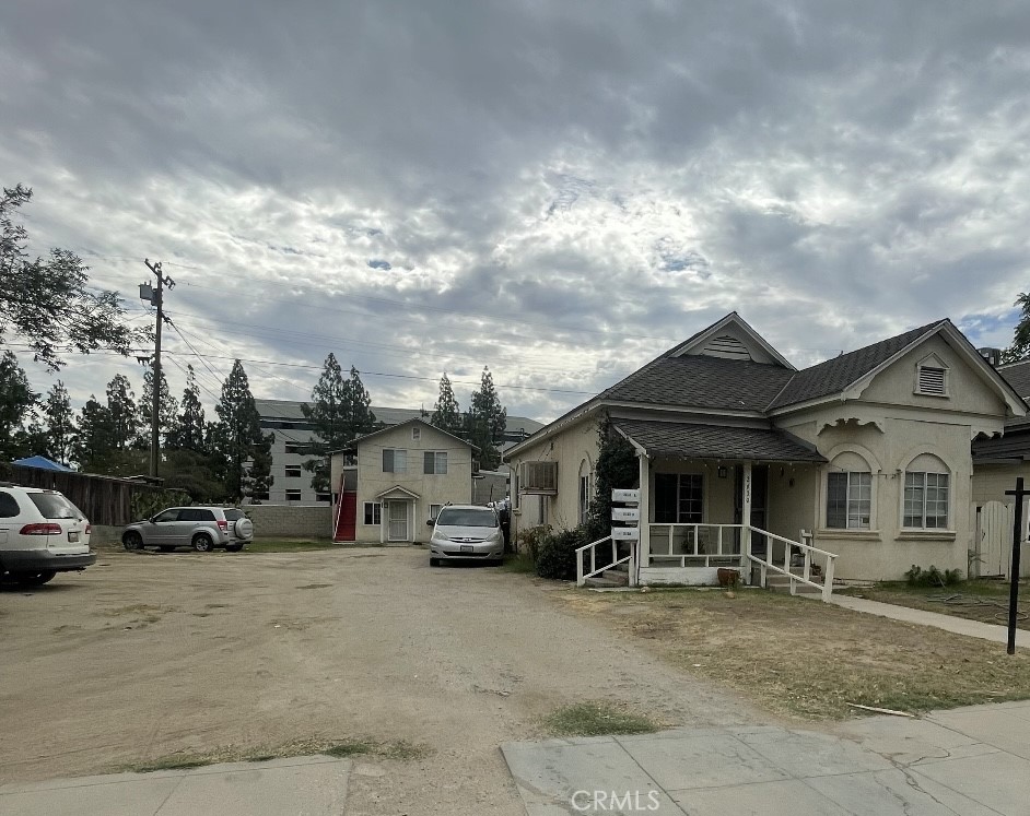 a view of a car park in front of house