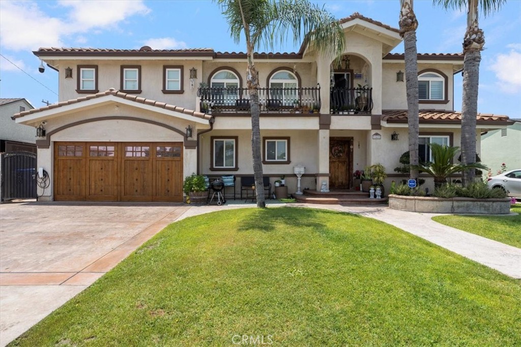 a front view of a house with swimming pool and porch